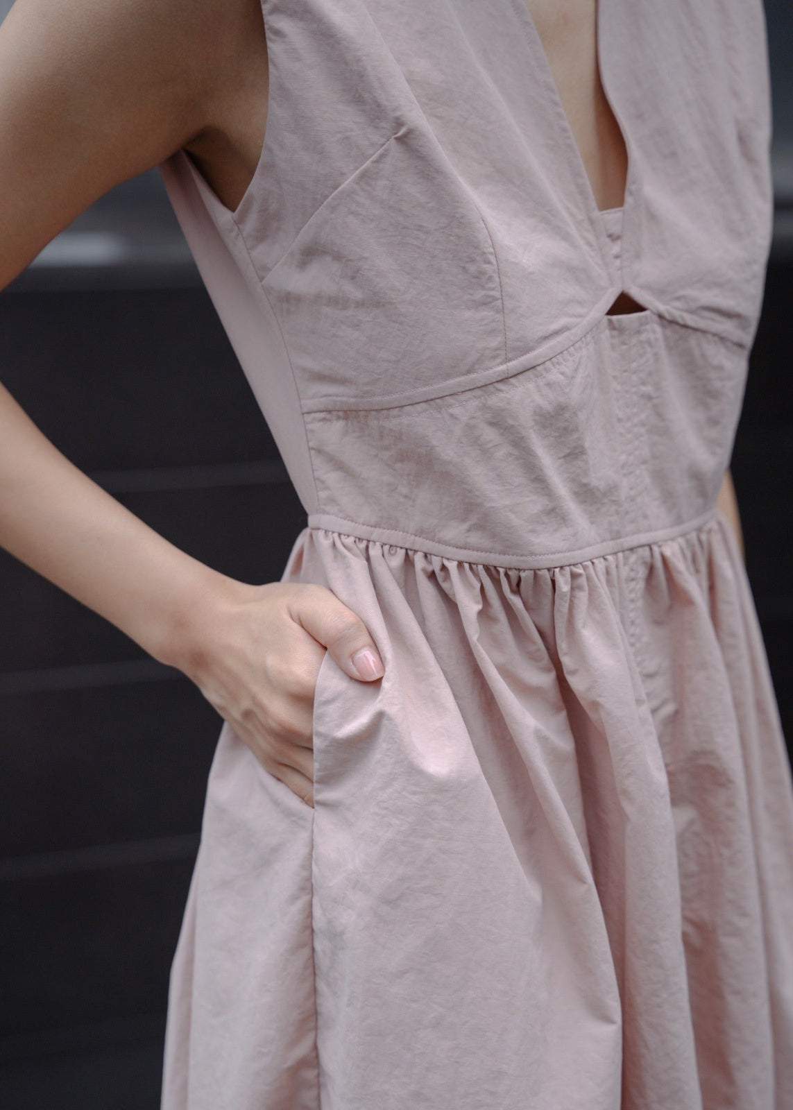 Close-up of a light pink dress with a blurred background