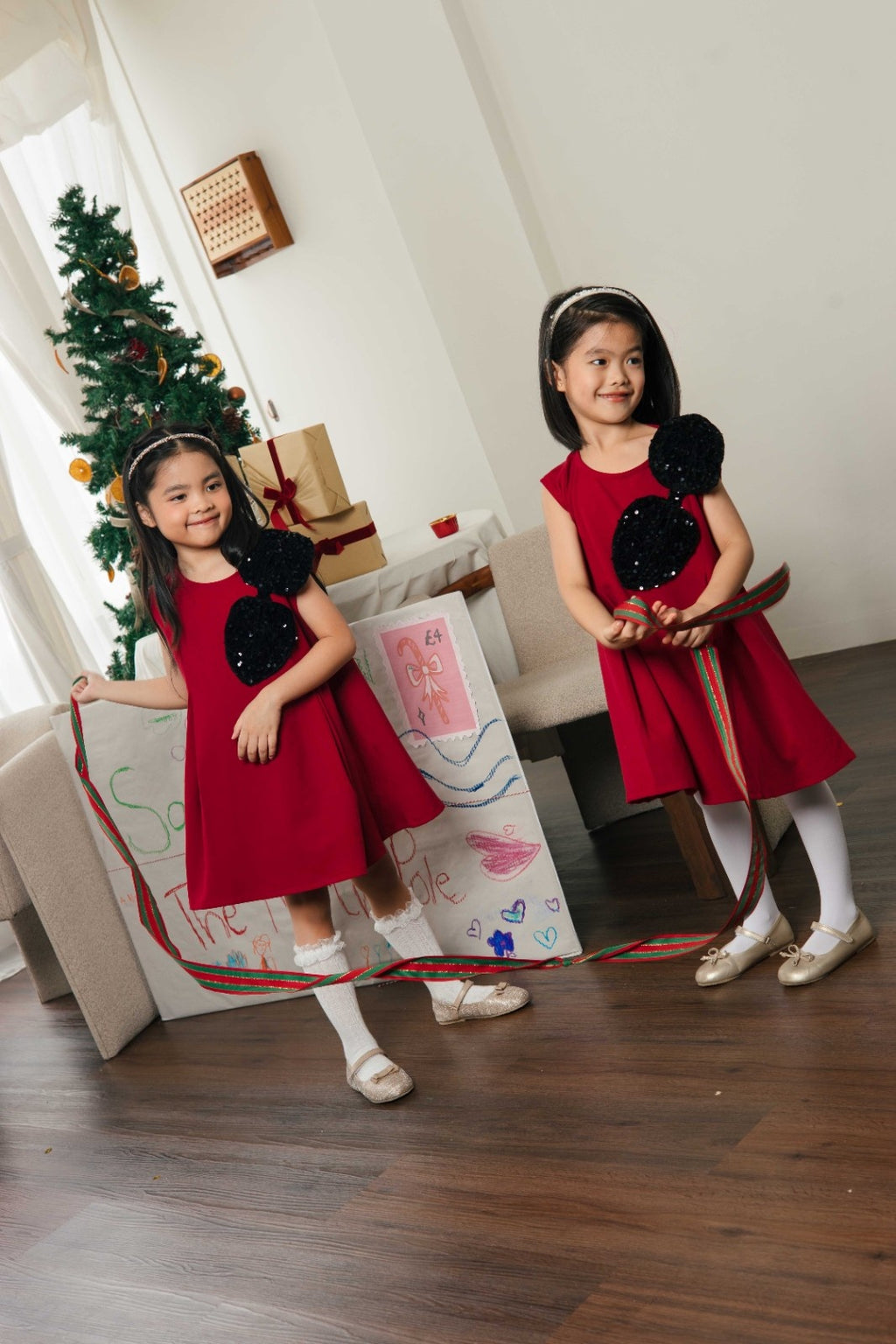 Carol Glitter Bow Dress – Festive Red Sleeveless Dress with Sequin Detail